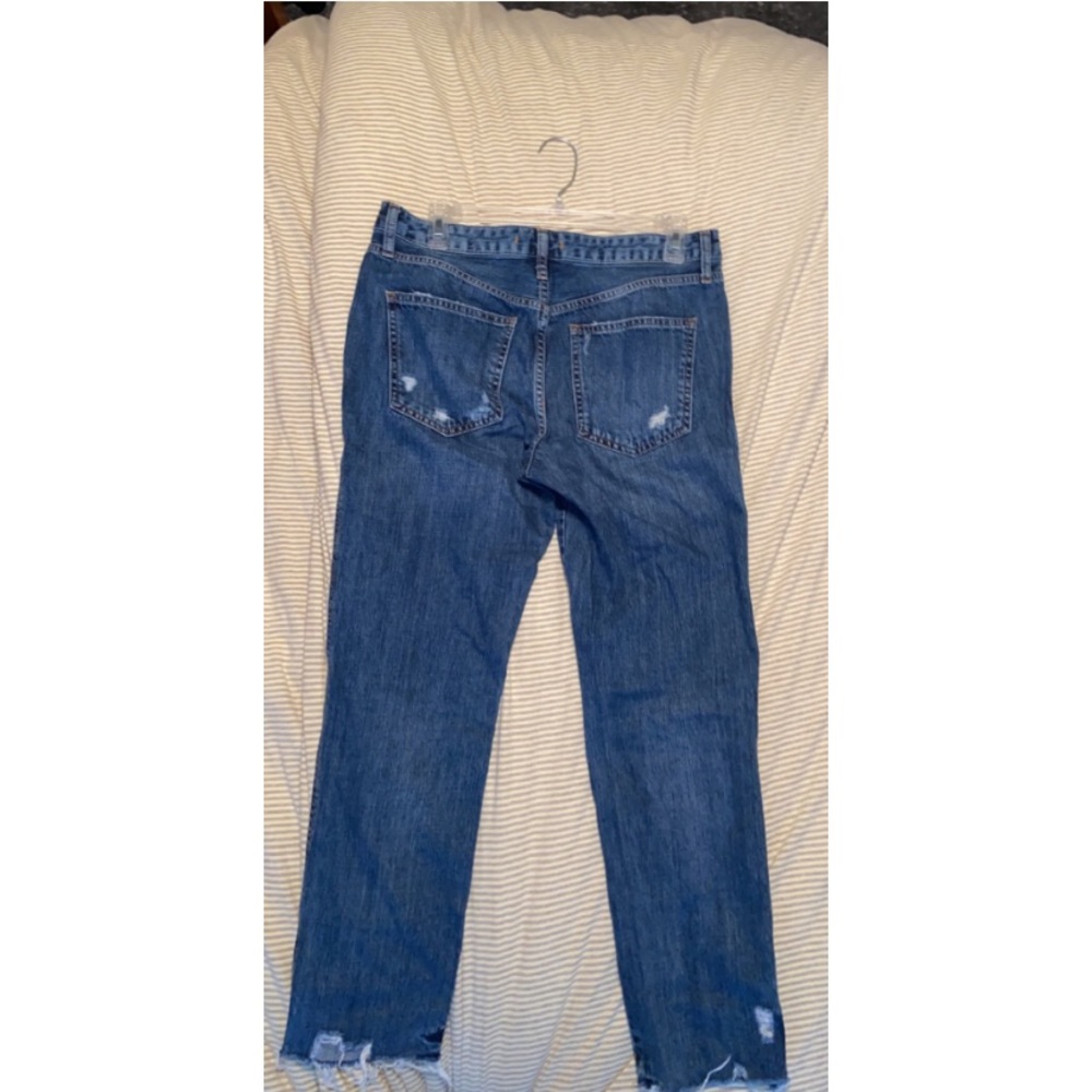Size 27 “WE THE FREE” Free People raw hem jeans